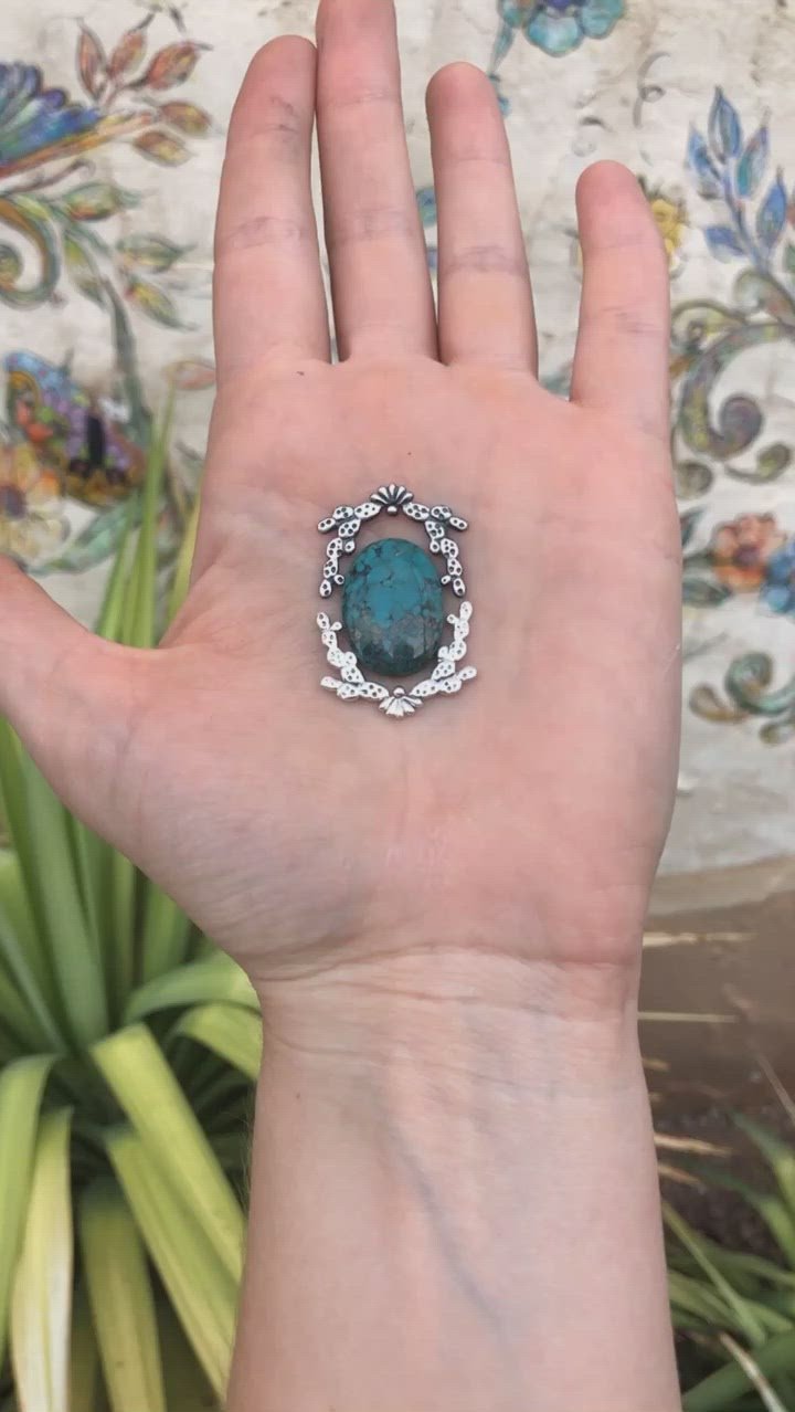 Silver cast prickly pear framing turquoise cabochon