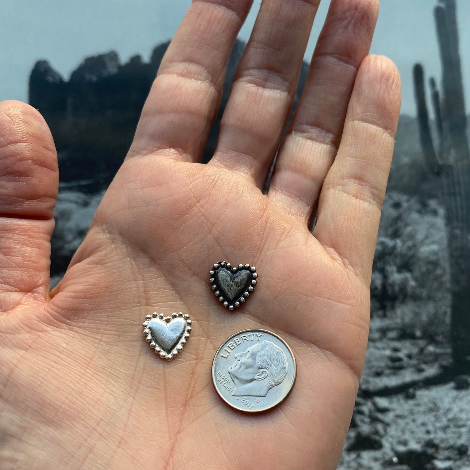 beaded silver hearts on hand