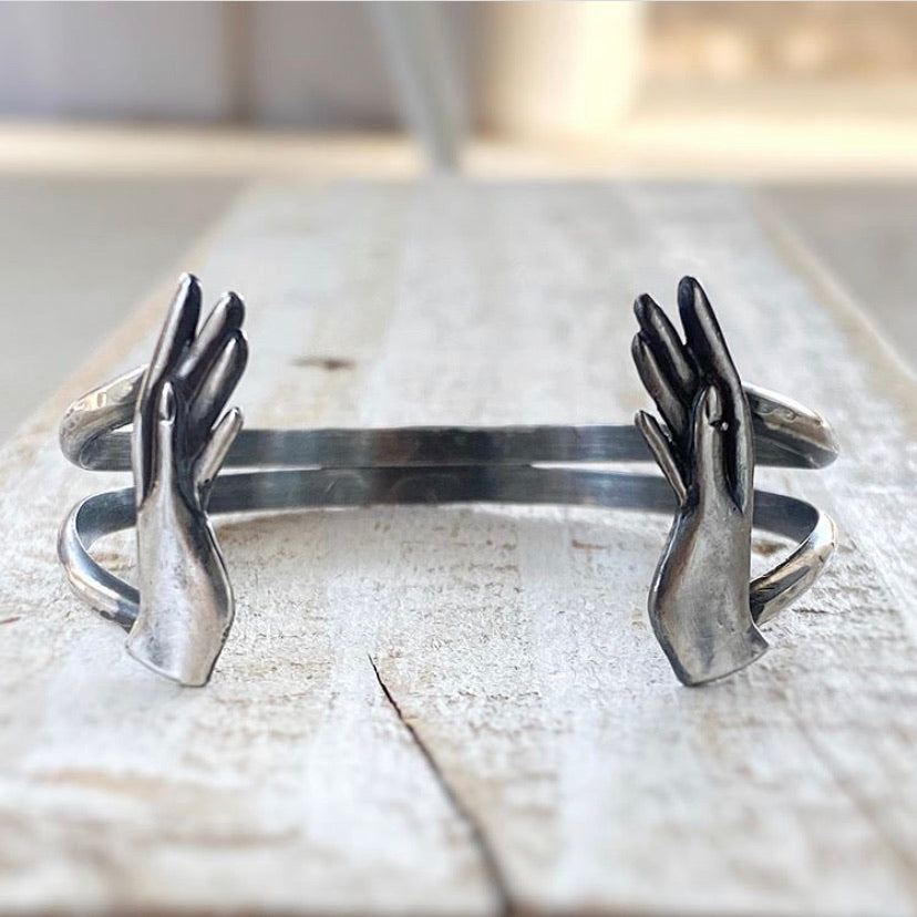 silver bracelet with hand castings