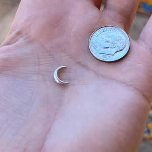 cast sterling silver crescent moon with dime for size reference