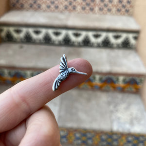 sterling silver hummingbird casting with patina on finger